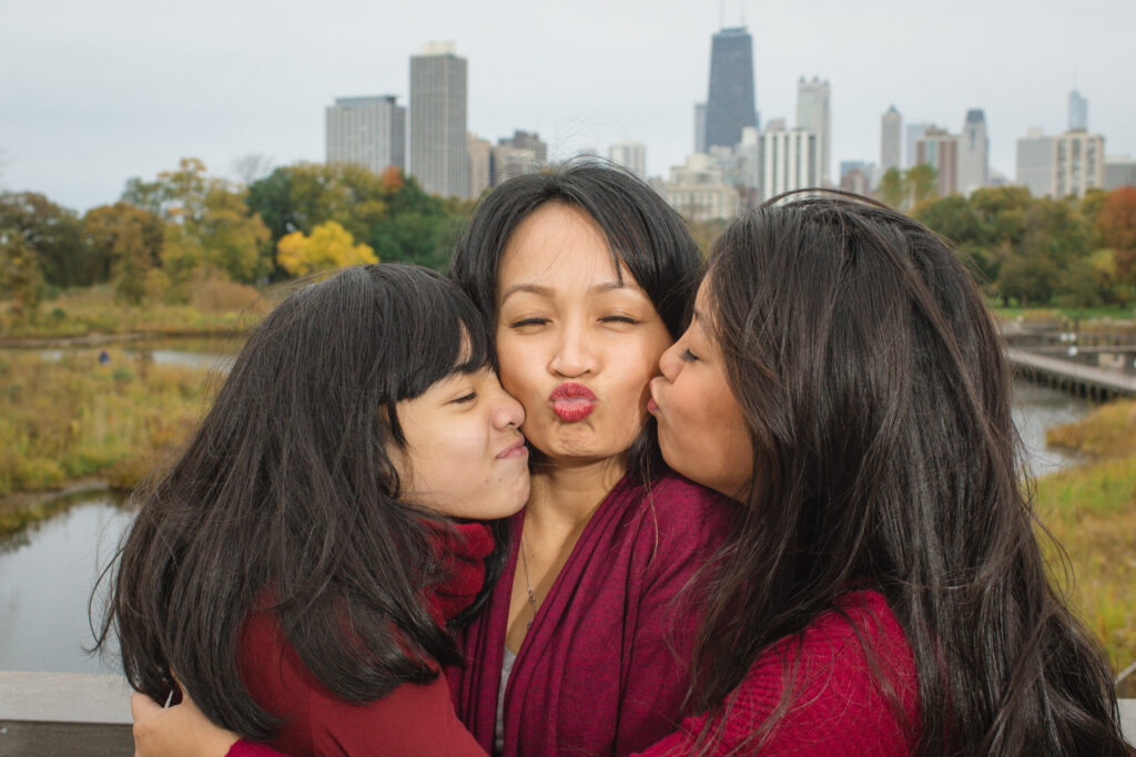 Mother's day Photography Session, Daughters kissing Mother